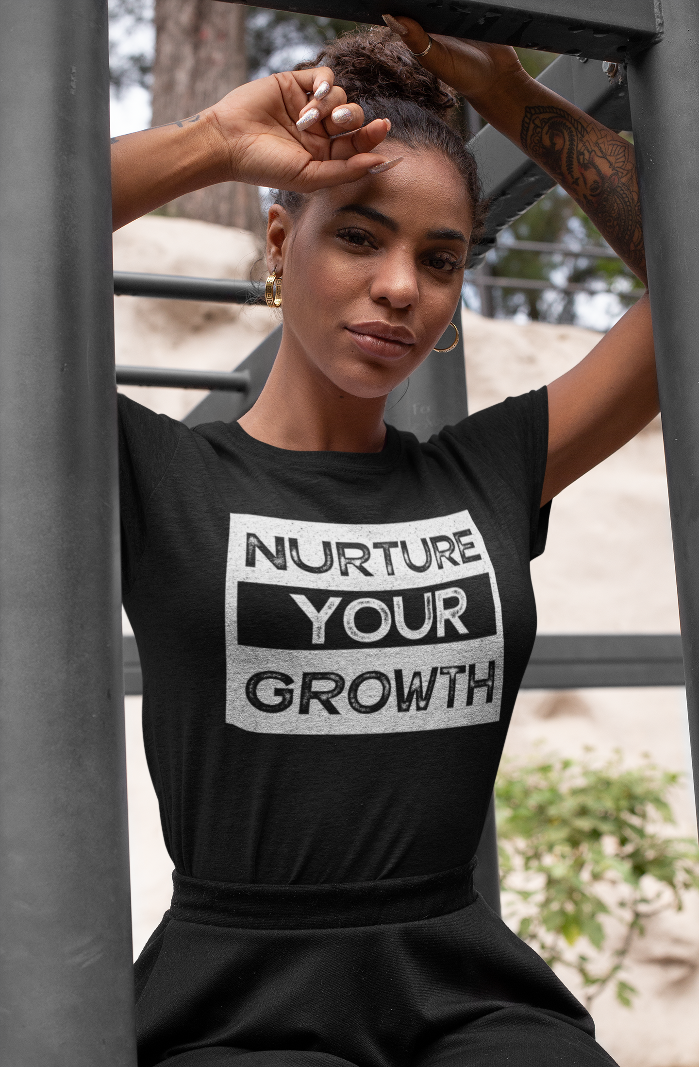 Nurture-Your-Growth-Tshirt-mockup-of-a-woman-wearing-a-heather-t-shirt-and-hoops-28635-2.png