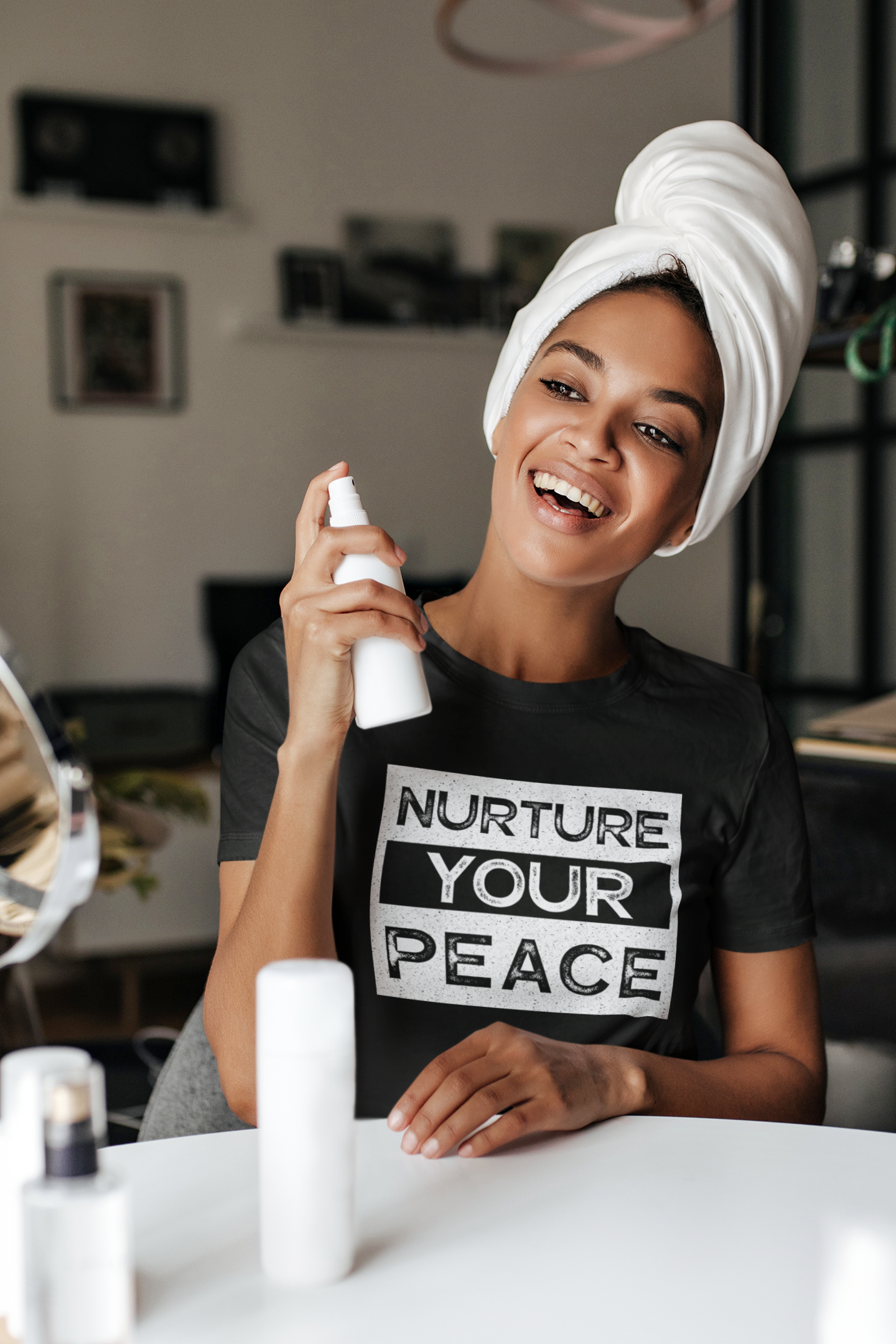 Nurture-Your-Peace-tshirt-unisex-round-neck-t-shirt-mockup-of-a-happy-woman-doing-a-skincare-routine-m11934-r-el2.png