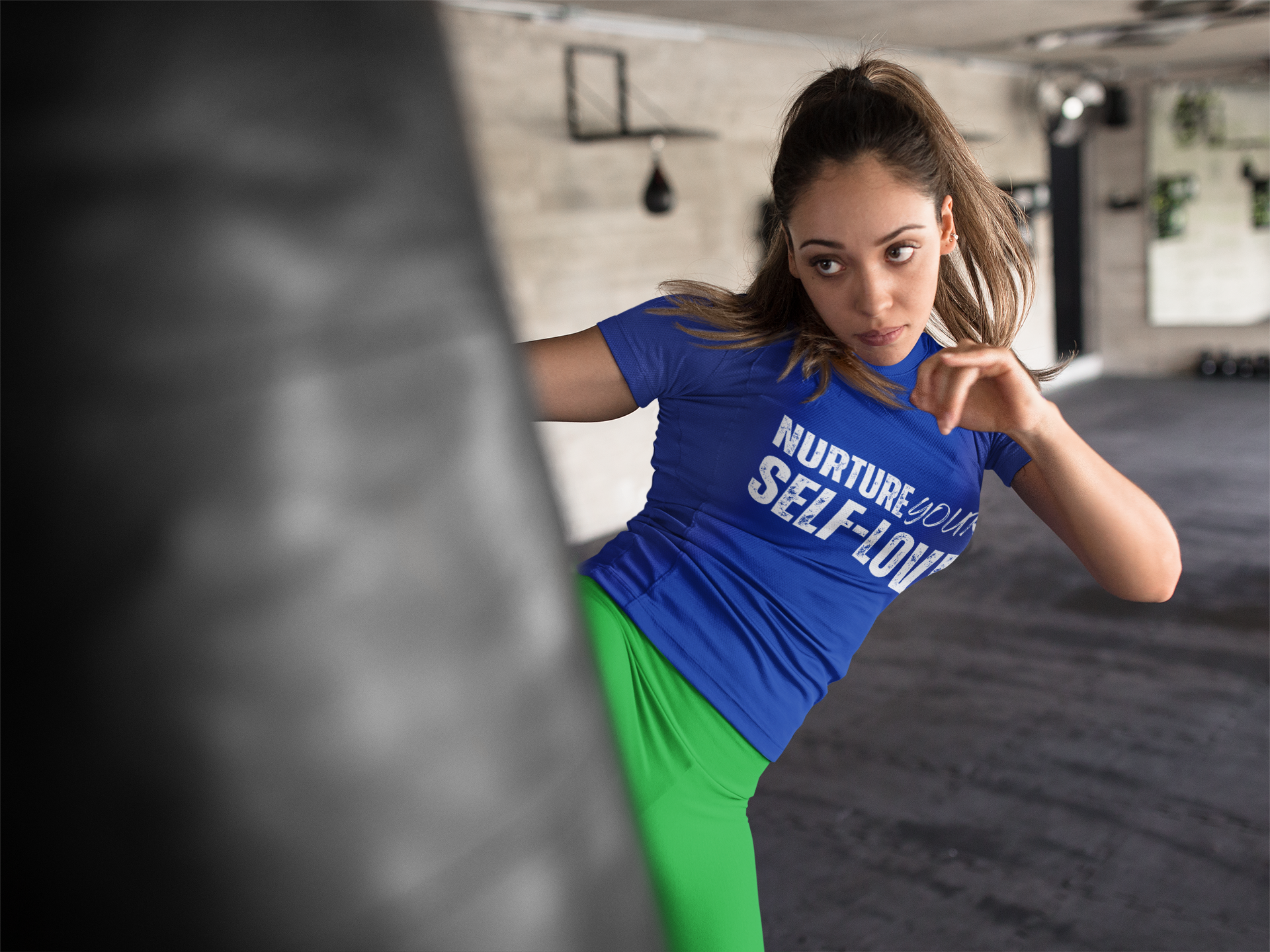 mockup-of-a-woman-kicking-a-heavy-bag-in-a-boxfit-class-wearing-custom-sportswear-a16844-3.png