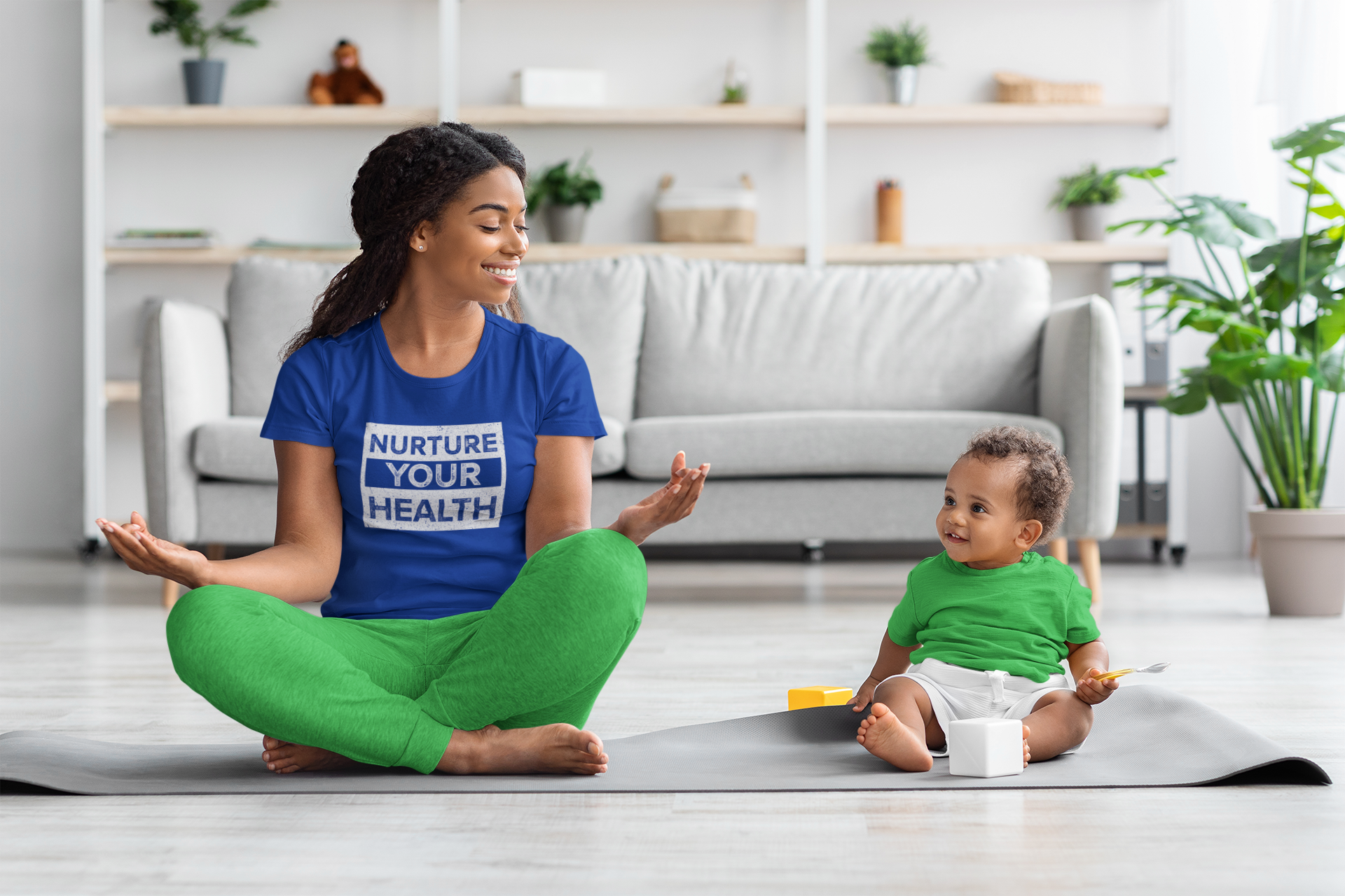 mockup-of-a-woman-wearing-a-t-shirt-and-meditating-with-her-baby-at-home-m21564-r-el2.png